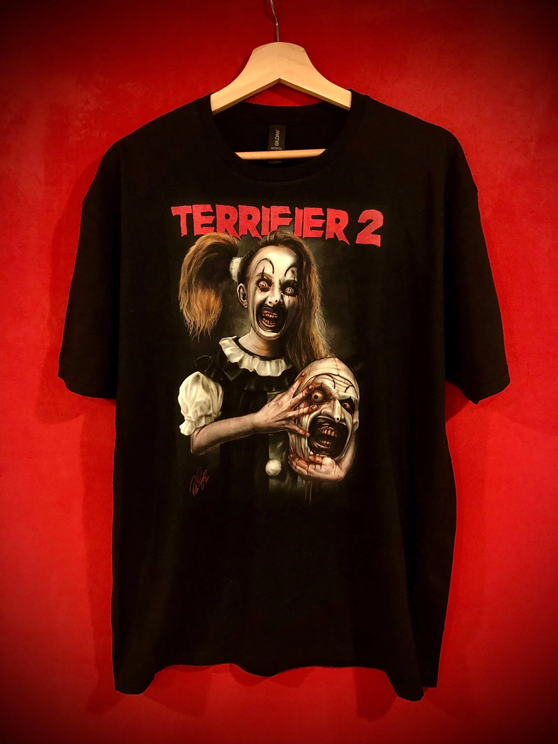 Official Little Pale Girl and Art Shirt graphic tee featuring Art the Clown and Emily Crane - Terrifier Merch